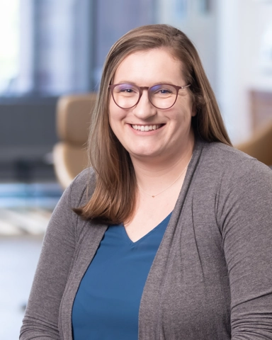 smiling person in professional attire